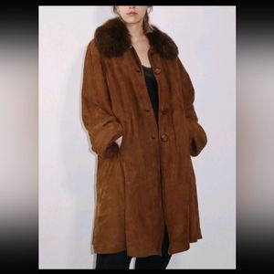 100%  Suede with a removable thick rich mink collar.